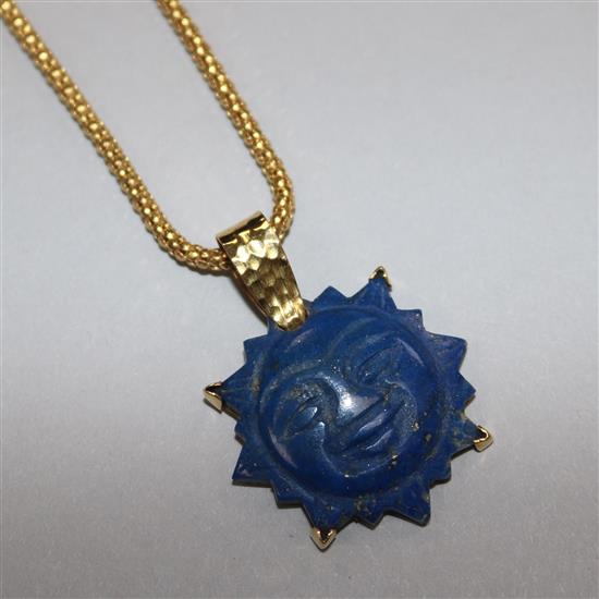 A yellow metal and lapis lazuli `moonface pendant on 22ct yellow gold suspension chain pendant 26mm.